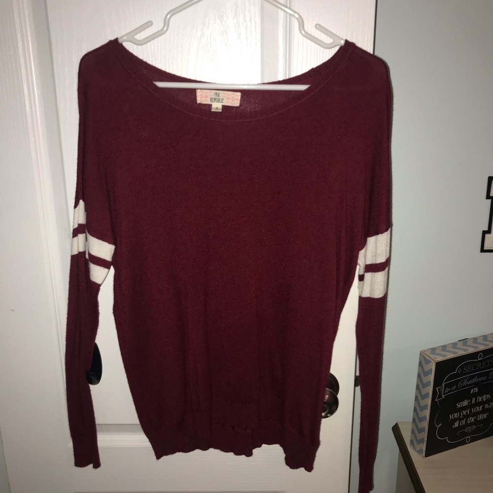 Maroon sweater with stripes on sleeves